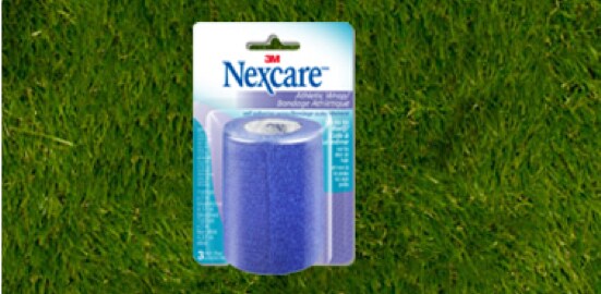A package of Nexcare™ Athletic Wrap on a lawn.
