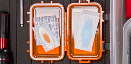 An open road trip first-aid kit with Nexcare™ Waterproof Bandages inside of it.

