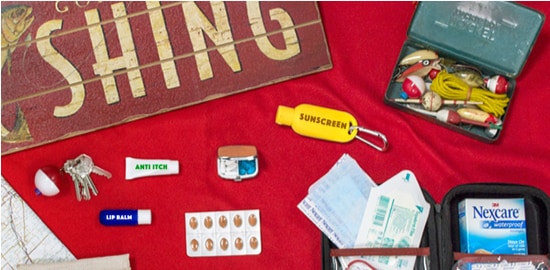 A counter with a fishing sign and tackle box, and assorted Nexcare™ Bandages.
